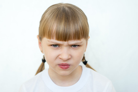 Young girl posing on white background isolatedの写真素材