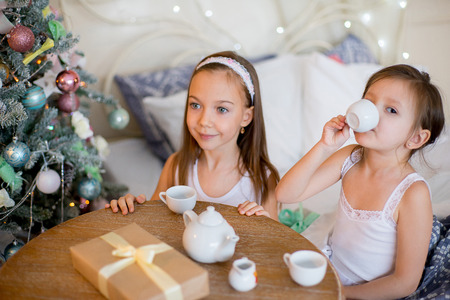 Child girls wake up in her bed in Christmas morningの写真素材