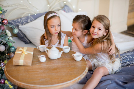 Child girls wake up in her bed in Christmas morningの写真素材