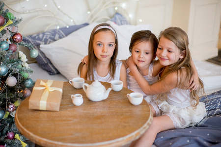 Child girls wake up in her bed in Christmas morningの写真素材