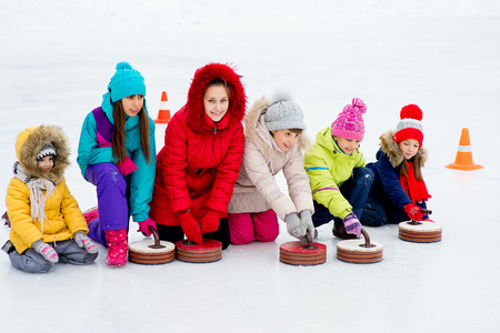 Young girls playing curlingの写真素材