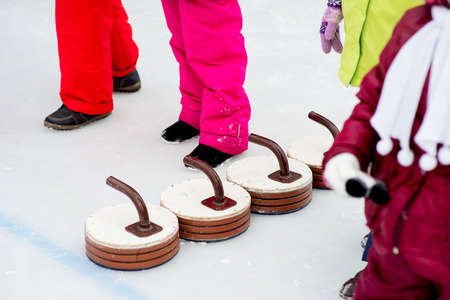 Young girls playing curlingの写真素材