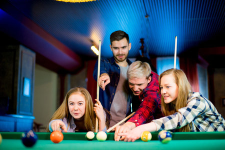 friends playing billiard