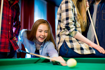 friends playing billiard