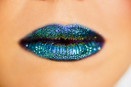 lips smeared with sequins closeupの写真素材