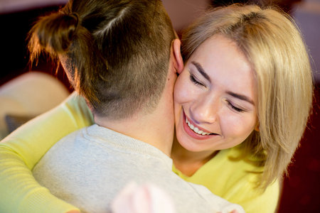 young man gives a gift to the girlfriend