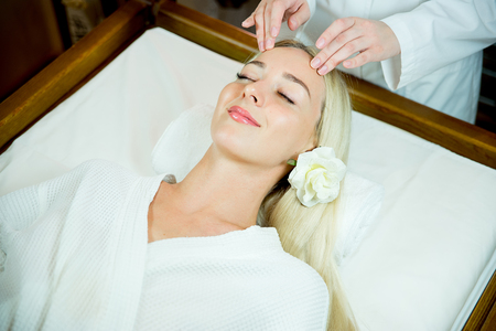 Girl doing face massageの写真素材