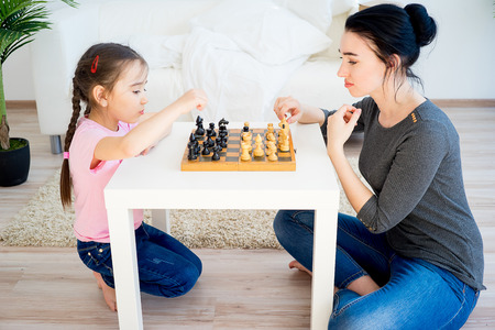 Family playing chessの写真素材