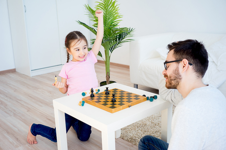 Family playing chessの写真素材