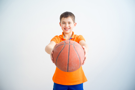 Boy playing basketballの写真素材