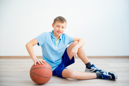 Boy playing basketballの写真素材