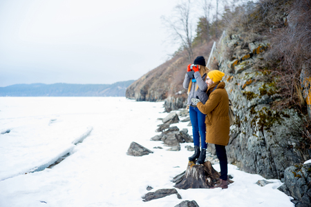 Couple hiking on a mountain lakeの写真素材