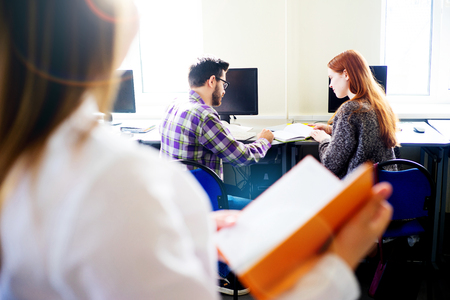Students working on computersの写真素材