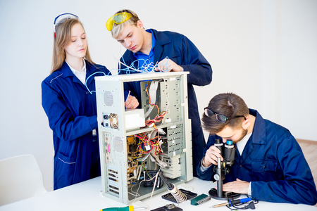 Technicians repairing computersの写真素材