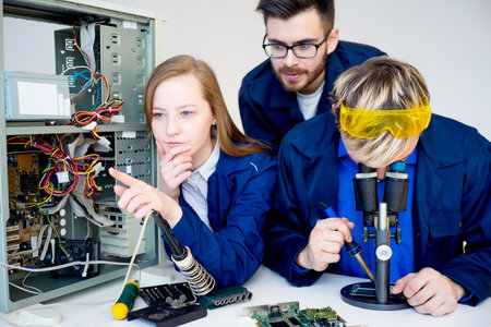 Technicians repairing computers