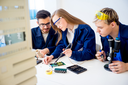 Technicians repairing computersの写真素材