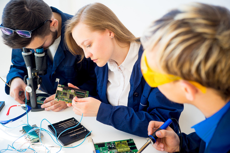 Technicians repairing computersの写真素材