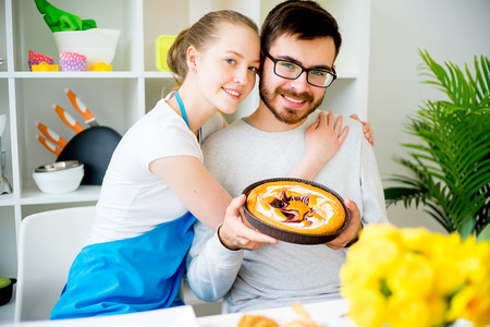 Wife cooking for husbandの写真素材