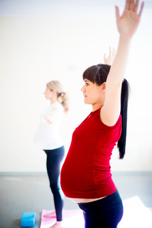Pregnant woman does yoga exercisesの写真素材