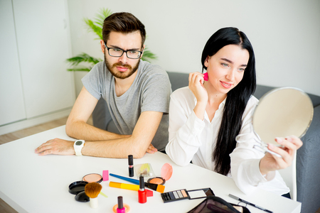 Bored husband waiting for wifeの写真素材