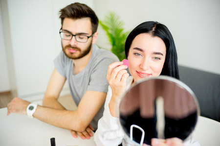 Bored husband waiting for wifeの写真素材