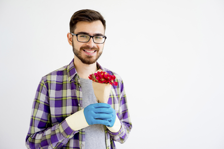 Male gardener with flowersの写真素材