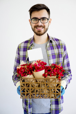 Male gardener with flowersの写真素材