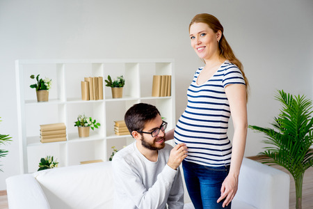 Pregnant woman with husbandの写真素材
