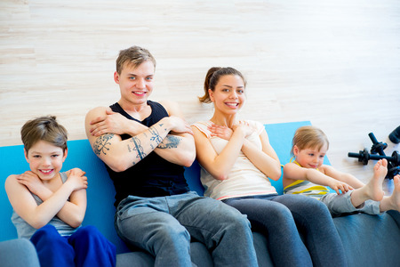 Family doing sit ups togetherの写真素材