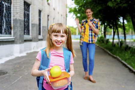 Mother and daughter at schoolの写真素材