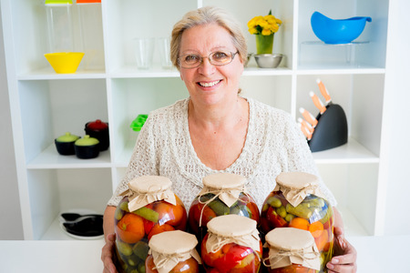 Senior lady with pickled foodの写真素材