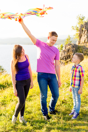 Family playing with a kiteの写真素材