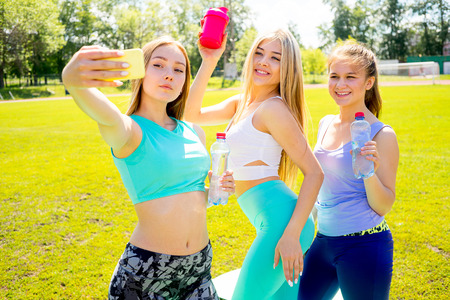 Girls taking selfies after yogaの写真素材