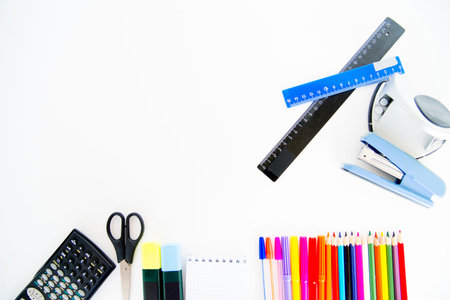 An image of different school objects on a table
