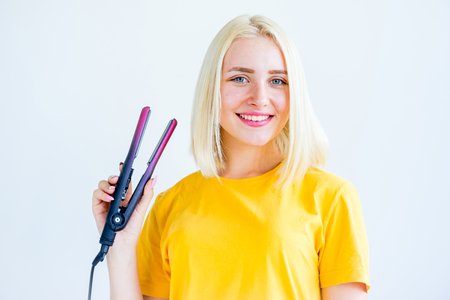 Girl taking care of her hairの写真素材
