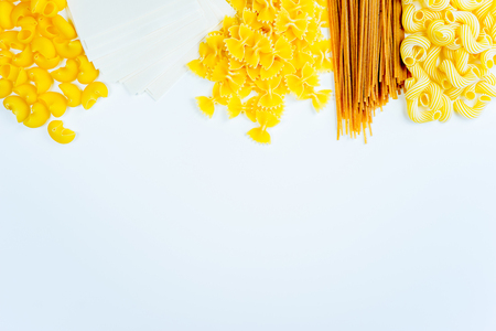 Various mix of italian pasta on a tableの写真素材