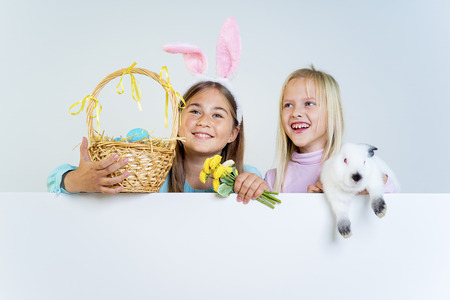 Girls with easter bunnyの写真素材
