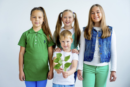 Kids with a plantの写真素材