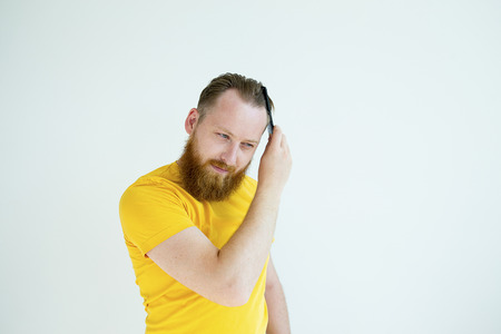 Guy trimming his beardの写真素材