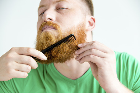 Guy trimming his beardの写真素材