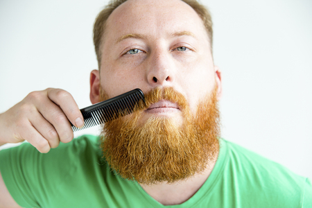 Guy trimming his beardの写真素材