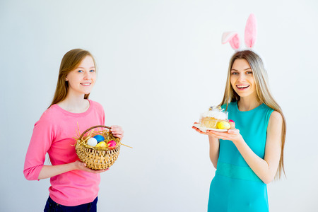Two teen sisters celebrating easterの写真素材