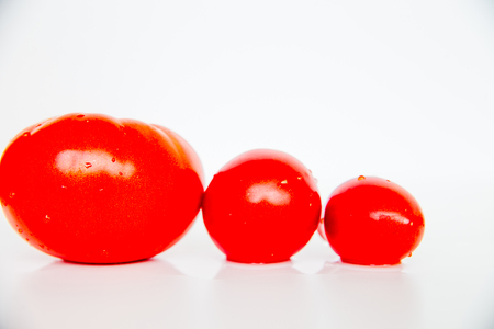 Creative layout of different fresh vegetables on a tableの写真素材