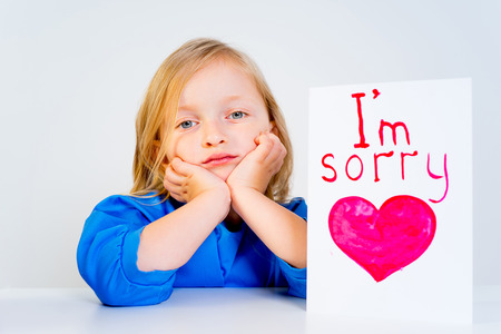 Girl with valentine postcardの写真素材