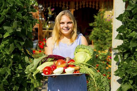 Girl working in a greenhouseの写真素材