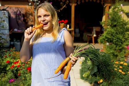 Girl working in a greenhouseの写真素材