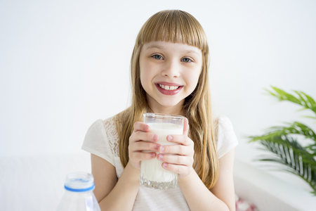 Girl having breakfastの写真素材