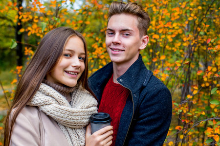 Couple walking in an autumn parkの写真素材
