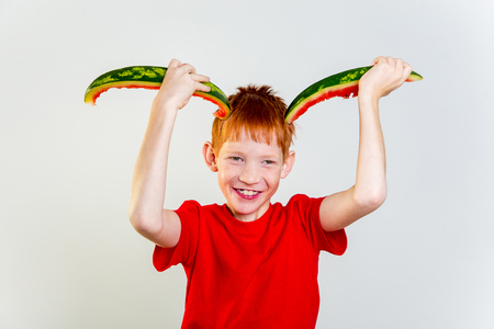 Kids eating watermelonの写真素材