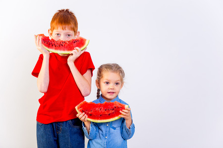Kids eating watermelonの写真素材